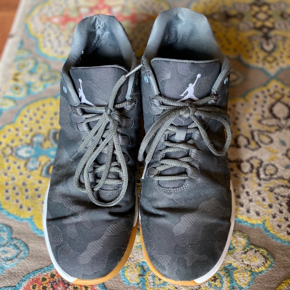 Air Jordan grey camouflage print sneakers.